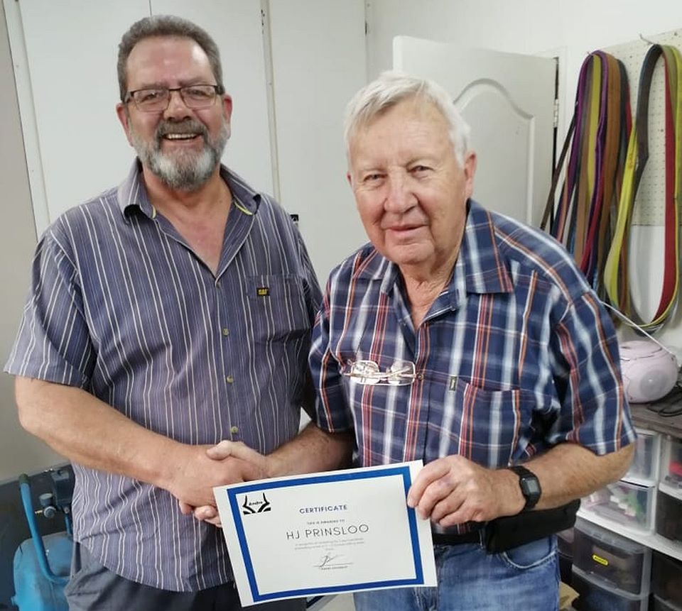 André Erasmus presenting a course completion certificate